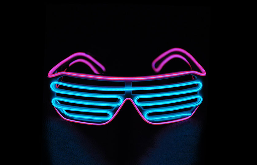 Neon Blue and Pink Glasses on a Black Background